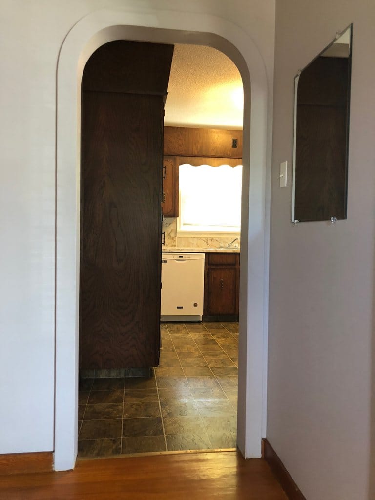 Looing into the kitchen from the short entry hall ... living room is on the right.