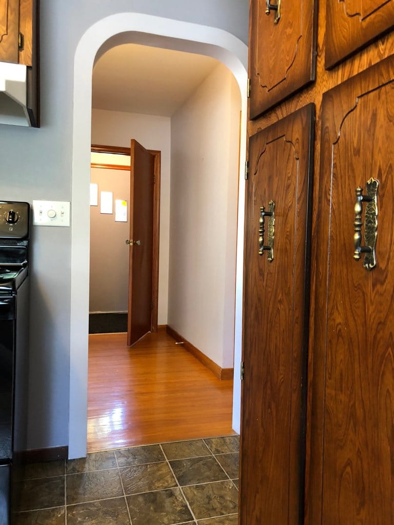 Reverse of the last shot, from kitchen into hall | foyer.  Note the large pantry on the right.
