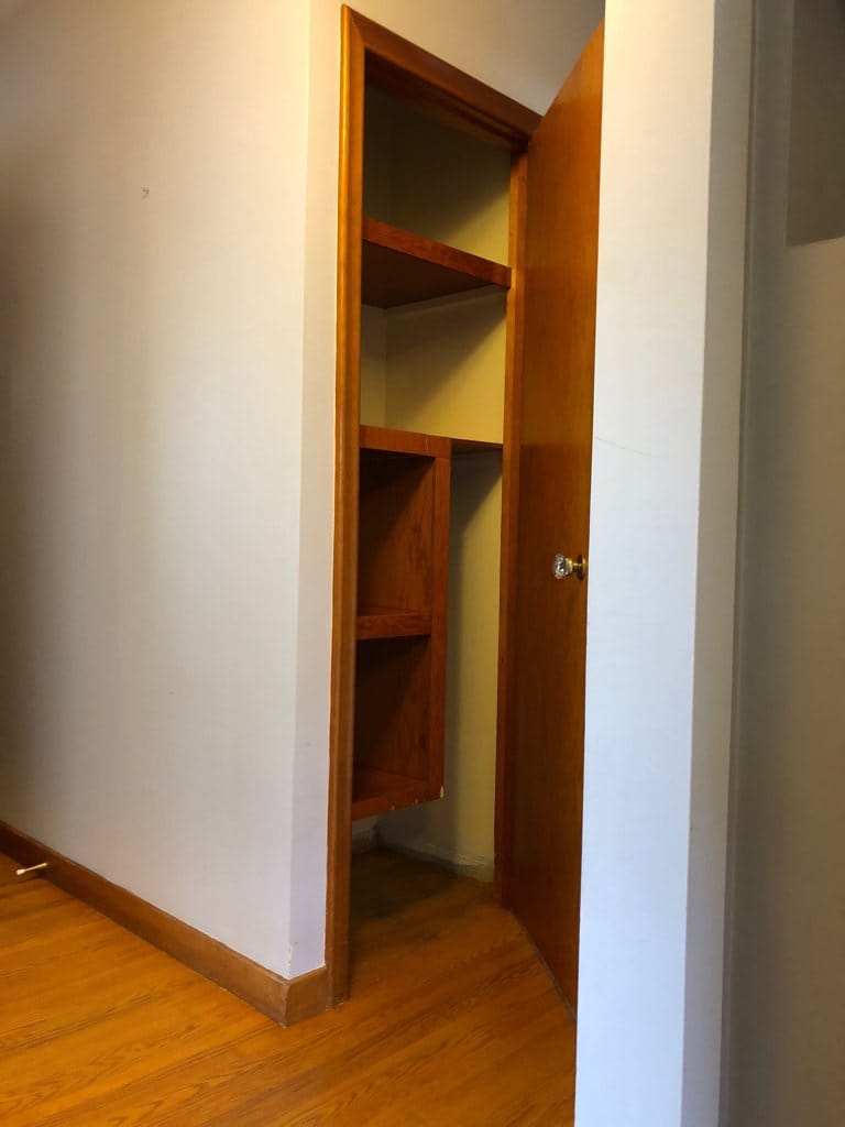 Broom | linen closet at hallway entry.